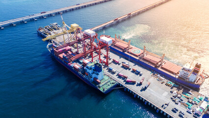 Tug boat pulling Cargo container ship go to international yard port. technology freight shipping...