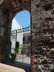 FUNERTE AMADOR, PANAMA - MAY 8, 2022 - Metal gate guarding the ancient building ruins in panama...