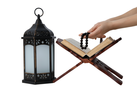 PNG, Ramadan. Quran book on a stand with a lantern, isolated on a white background.