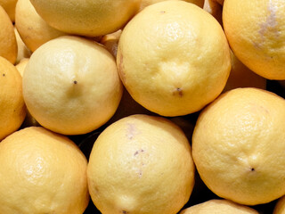 Close Up Of Fresh Citrus Fruits Displayed At A Market Place 