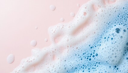Pink and blue soap foam, abstract textures on a pastel surface