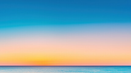 Fototapeta premium serene gradient sky transitioning from bright azure to warm sunset hues over ocean