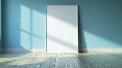Empty white frame against a light blue wall with shadows on wooden floor, ideal for art display