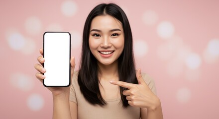 Naklejka premium woman holding smartphone showing with blank white screen, pointing on blank isolated pastel background.