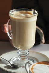 Enjoying a warm beverage in a cozy cafe setting