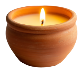 Terracotta candle with bright flame in clay pot, cozy and warm atmosphere concept
