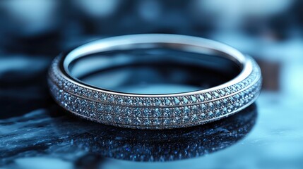 Elegant diamond-studded ring resting on a glossy surface, showcasing intricate details and reflections