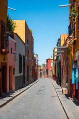 Colorful Colonial Street and Road of San Miguel de Allende Mexico. Mexican streets with colorful houses of all colors in the sunshine