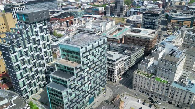 Aerial View of Modern Central Town Center and Downtown Buildings at British City Centre of Liverpool, Maritime city in northwest England, United Kingdom on Beach and Ocean Docks. May 5th, 2024.