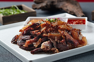 Sliced charcoal grilled beef ribs with dipping sauce