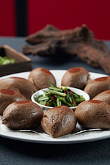 Salted chives with roasted black rice flour bun