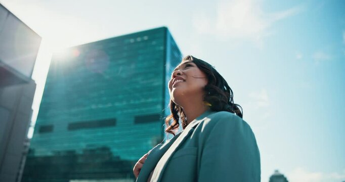 Urban, thinking and happy businesswoman in street for travel and decision with low angle or view. Imagine, smile and city developer by buildings for inspiration with confidence and creative ideas