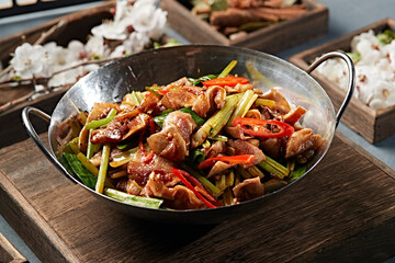 Spicy pork ears with garlic sprouts