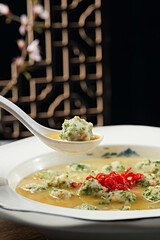 Shrimp balls with coriander and broth