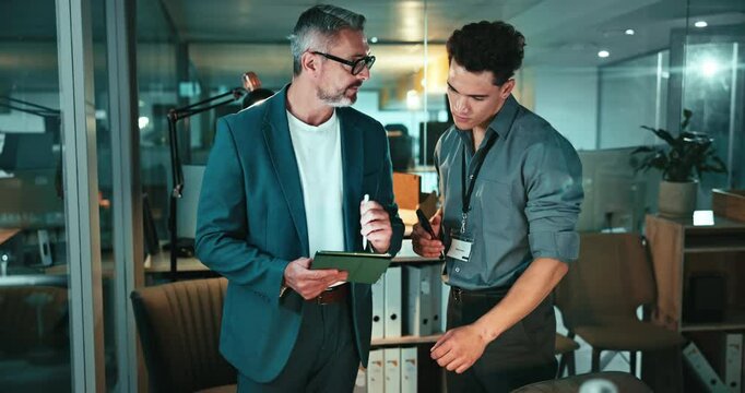 Night, talking or business people with tablet in office for feedback or mentorship for investment banking. Teamwork, economy and financial analysts online for news, audit advice and finance report