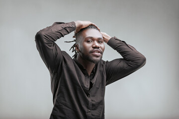 Young man holding his head with his hands