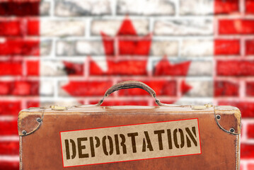 Flag of Canada, a suitcase and deportation sticker