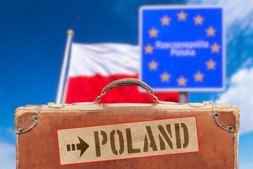 Polish flag, a suitcase and destination Poland
