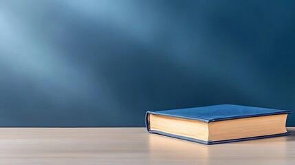 Calm indoor still life photography close-up of book on table representing knowledge