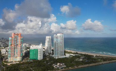 Fototapeta premium Luxurious vacation. Aerial South beach landscape. Luxury Miami skyscraper. Miami south beach. Cityscape landscape of South Beach. Florida skyscraper on horizon. Skyscraper architecture of Miami