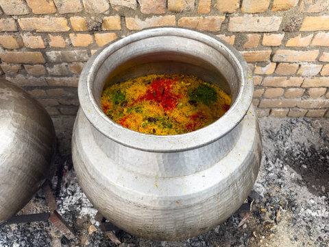 Zarda Pakistani Sweet Rice in Deg. Degi Zarda Chawal or Pakistani Sweet Rice in Traditional Cooking Pot in Wedding or Festival Events.