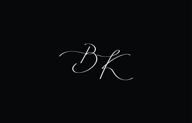 A minimal yet stylish depiction of white cursive lettering forming BK on a dark background, symbolizing elegance and simplicity.