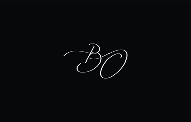 A minimal yet stylish depiction of white cursive lettering forming BO on a dark background, symbolizing elegance and simplicity.