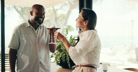 Mature, couple and toast with alcohol at house on Valentines day, celebration and anniversary. People, cheers and wine for romantic date, laughing and funny memory with marriage commitment with love