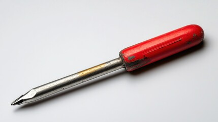 Fototapeta premium Old red-handled screwdriver on white background. Possible use stock photo for tool catalog or repair guide