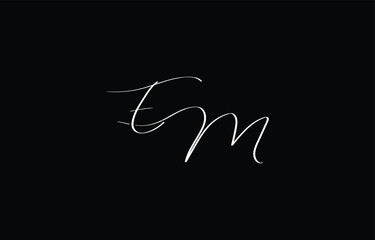 A minimal yet stylish depiction of white cursive lettering forming EM on a dark background, symbolizing elegance and simplicity.