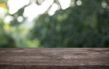 Empty wood table top and blur of restaurant background selective focus product display