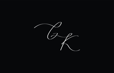 A minimal yet stylish depiction of white cursive lettering forming GK on a dark background, symbolizing elegance and simplicity.