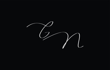 A minimal yet stylish depiction of white cursive lettering forming GN on a dark background, symbolizing elegance and simplicity.