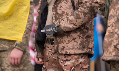 Ukrainian veteran soldier with prosthetic. War in Ukraine. Veteran rehabilitation. Russia Ukraine war, military rehabilitation. Ukrainian veteran rehabilitation, soldier with prosthetic arm.