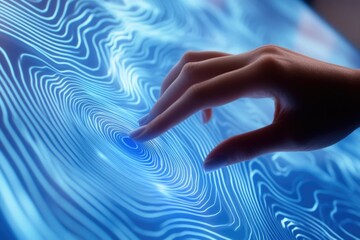 A hand interacts with a futuristic, blue, digital interface displaying dynamic, wave-like patterns.
