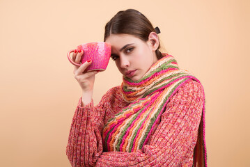 Sick woman drink medicine from mug. Woman holding a mug with hot drink for flu symptoms. Ill woman...