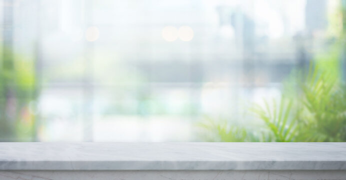 Selective focus.Elegance product display background with marble top on blur big window and fresh garden.copy space.not ai generated
