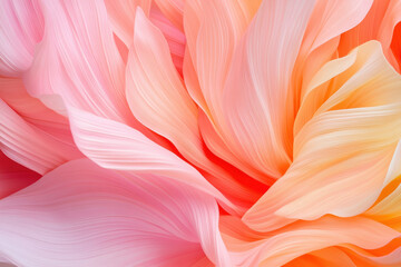 Abstract closeup of pastel colored flowing petals with soft pink and orange hues
