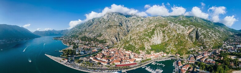 A drone camera panoramic view of Kotor coastline, Old Town, and Kotor Bay, Montenegro