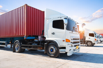 Row of Semi Trailer Trucks on The Parking Lot. Big rig, Tractor Truck. Shipping Cargo Container. Economy Business Transport on Road. Import- Export. Trucking. Freight Logistics Cargo Transportation.