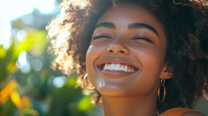 Happy Young Woman Smiling in Sunlight with Curly Hair Outdoors