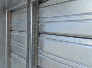 Close-up shot of flaps of fire damper.	
