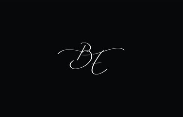 A minimal yet stylish depiction of white cursive lettering forming BE on a dark background, symbolizing elegance and simplicity.