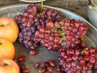 fresh red grapes on wooden background