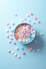 Colorful candy hearts scattered around vibrant bowl celebrating
