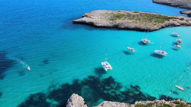 Explore the breathtaking Cala Varques in Mallorca, where turquoise waters meet rugged cliffs and peaceful sailing. Experience tranquility and natural beauty in this idyllic coastal paradise.