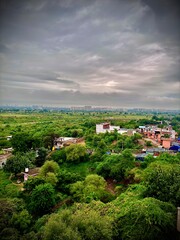 Lush Green Landscape with Urban Horizon