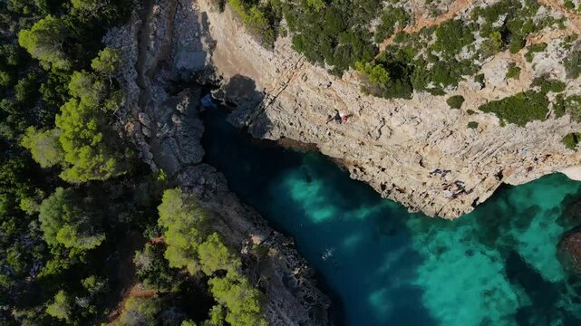 Explore the stunning Cala Varques in Majorca, where crystal-clear turquoise waters and rugged cliffs meet. This tranquil spot offers a unique escape for nature lovers and adventure seekers.