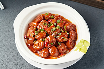 Braised spicy pig tail in casserole