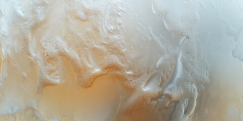 Close-up of a muddy water surface with earthy tones, reflecting the surrounding environment in its swirling patterns.